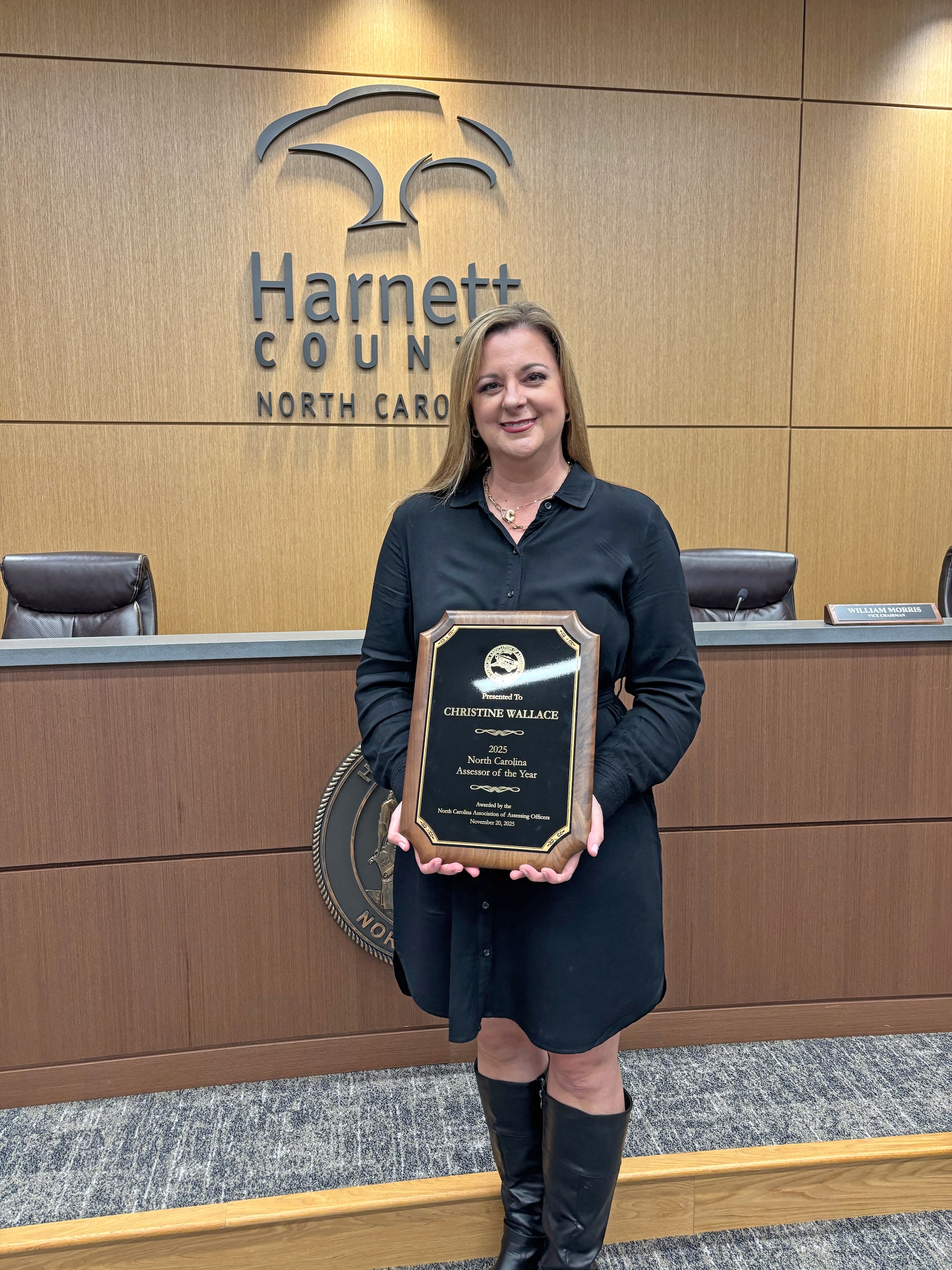Picture of Christine Wallace holding her award