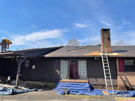 Person repairing a roof