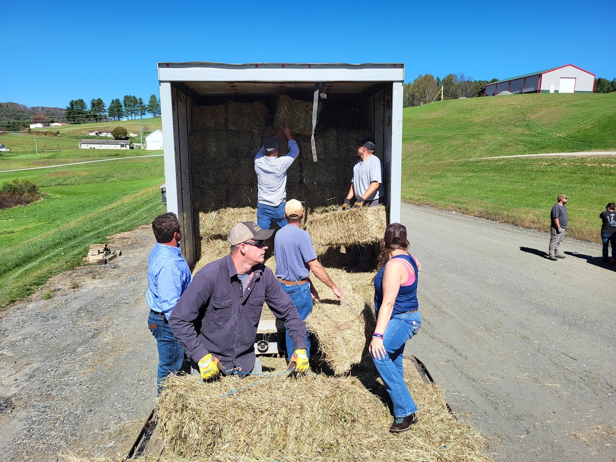 Harnett SWCD staff assisting with a delivery of hay to Western NC