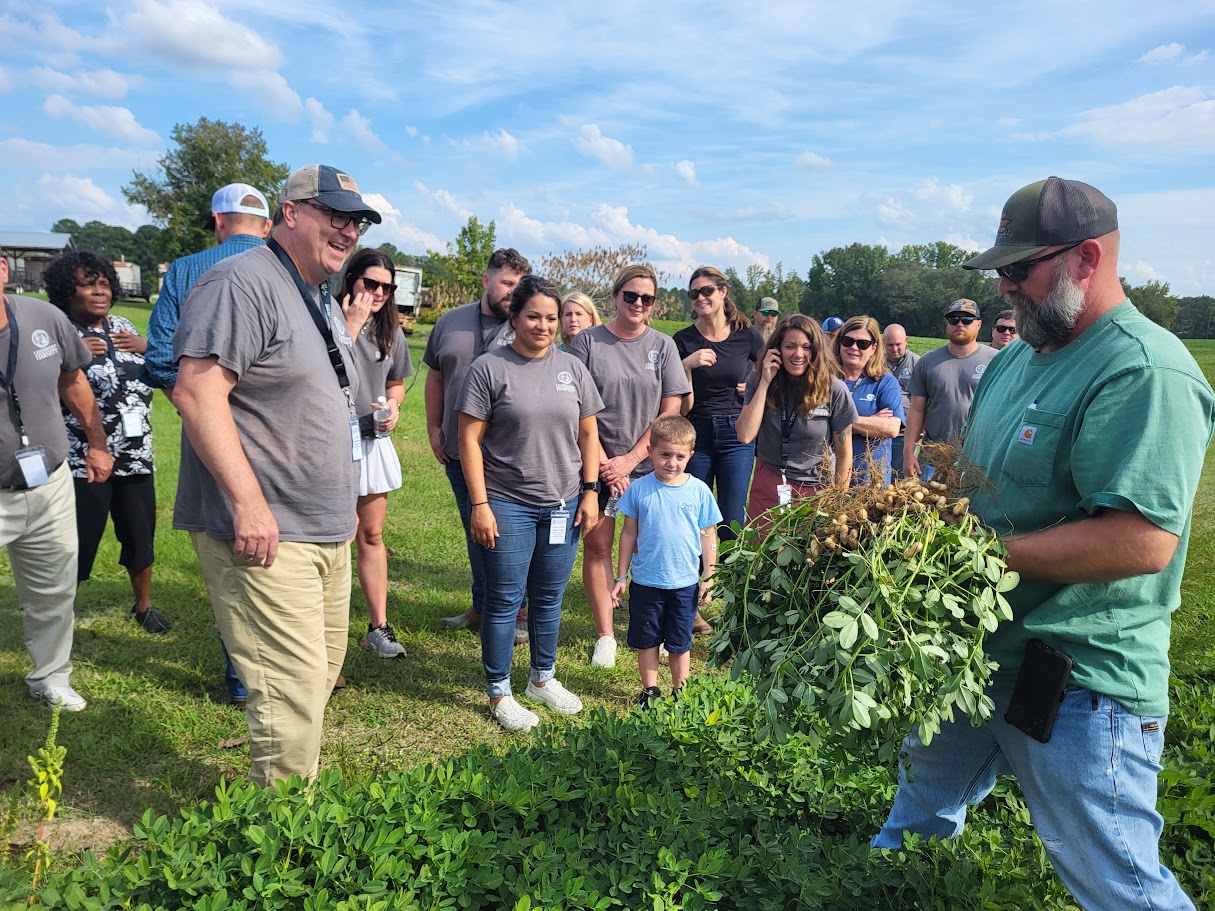 Local Farmer educating the 2024 Leadership Harnett class about peanuts and their underground growing process.